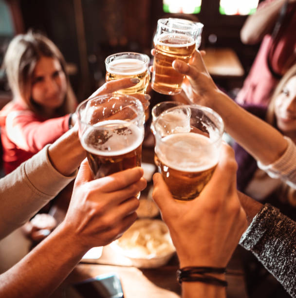 istock people talking and toasting in a pub with the beers 1224296671