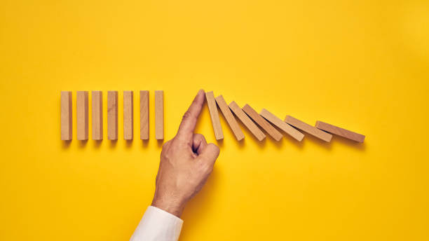 istock Men's hand and wooden blocks arranged in a conceptual image 1224297098