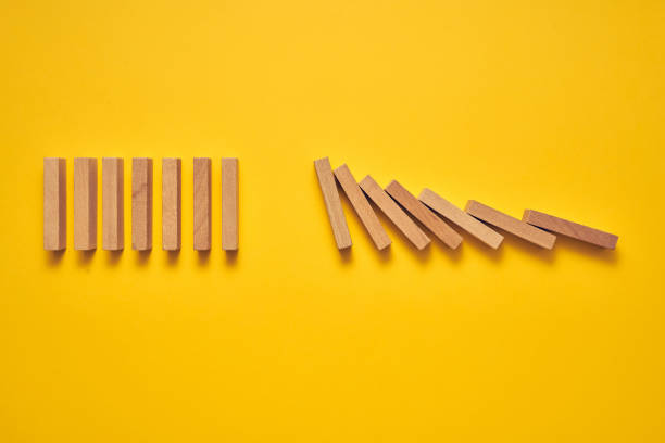 istock Wooden domino blocks arranged in a conceptual image 1224297102