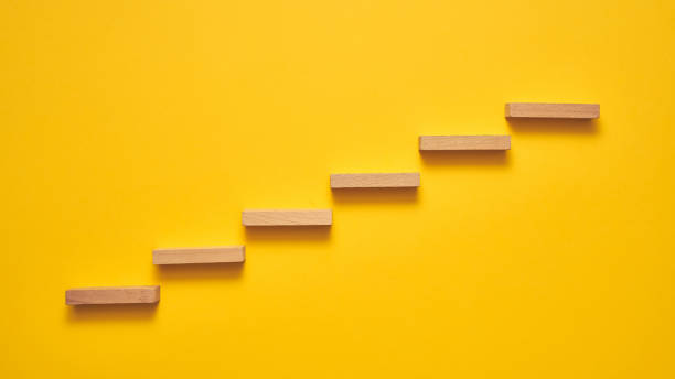 istock Climbing the stairs to success and progress in a conceptual image 1224297106