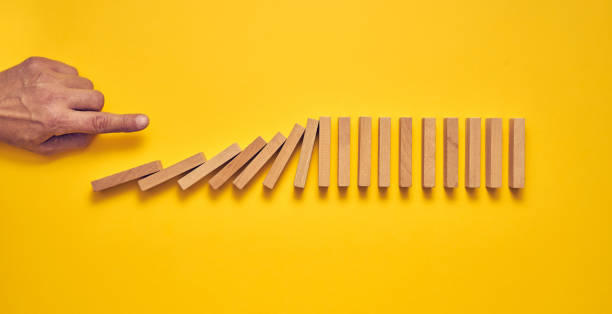 istock Men's hand and wooden blocks arranged in a conceptual image 1224297444