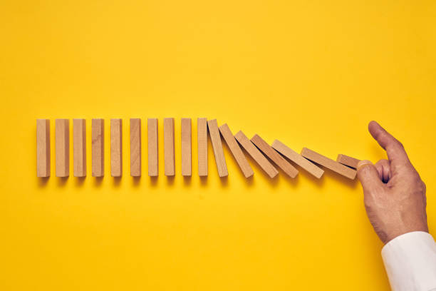 istock Men's hand and wooden blocks arranged in a conceptual image 1224297627