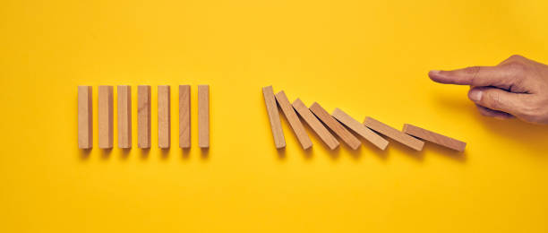 istock Men's hand and wooden blocks arranged in a conceptual image 1224297654