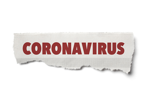 Coronavirus Headline on Torn Piece of Newspaper with White Background.