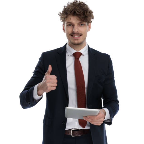 istock Positive businessman holding tablet, smiling and gesturing ok 1224302000
