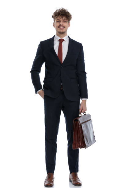 istock Positive businessman smiling and holding his briefcase 1224302039