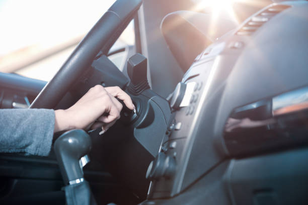 istock Woman starting car engine 1224303117