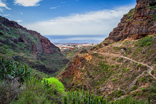 Hiking trail in the Barranco del Infierno - Hell Gorge, view to Adeje town in Tenerife, Canary Islands, Spain