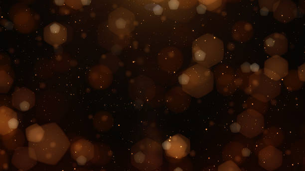 istock Abstract beautiful double bokeh flickering gold tone particles and light flare blurred glowing gradient background. concept for wedding card design 1224303282