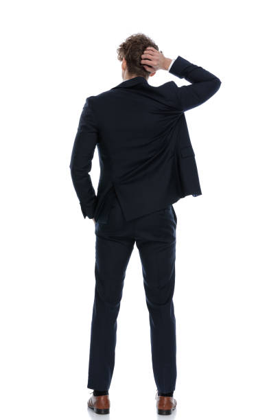 istock Rear view confused businessman scratching his head 1224304300