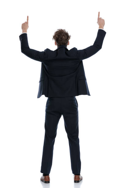 istock Rear view businessman pointing up with both of his hands 1224304326