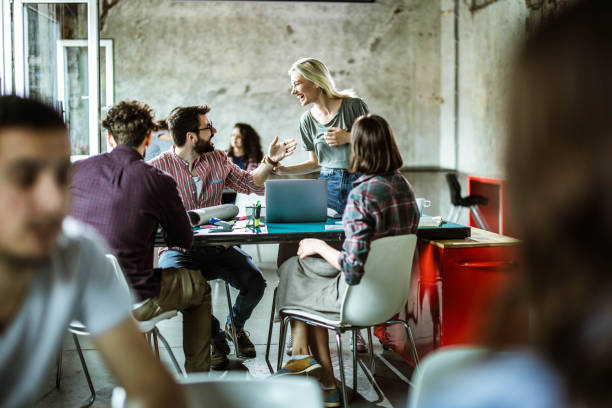 istock Happy start up team talking on a meeting at casual office. 1224304389