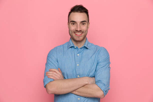 istock casual man crossing his hands to chest, smiling 1224304444
