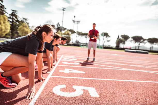 istock athletes reading to start on the track 1224304515