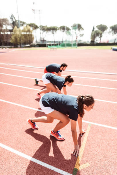 istock athletes reading to start on the track 1224304541