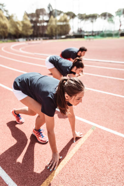 istock athletes reading to start on the track 1224304593