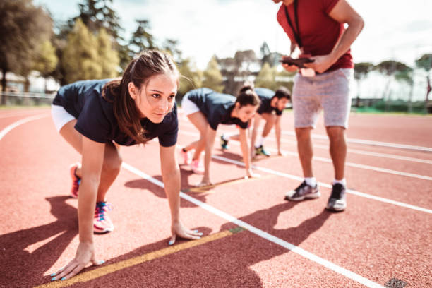 istock athletes reading to start on the track 1224304639