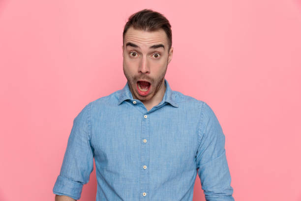 istock shocked casual man is opening his mouth wide 1224305921