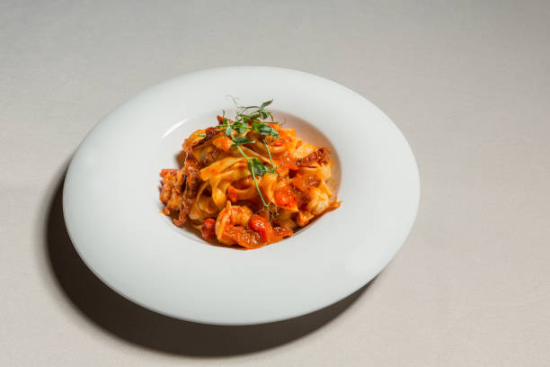 istock Creamy pasta with tomato and meat 1224306100