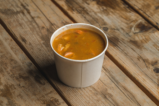 Cajun seafood gumbo in a to go containter