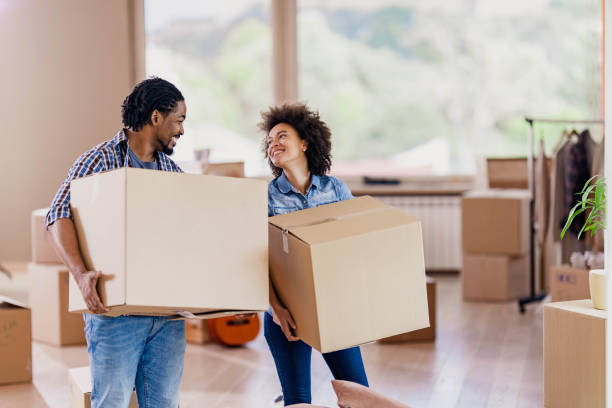 istock Happy African American couple talking while moving into new apartment. 1224308588