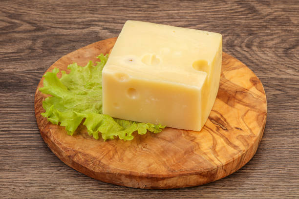 istock Emmental cheese over wooden board 1224308844