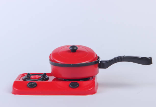 istock Toy plastic stove with pan on a white background. Kid's Kitchen 1224309829