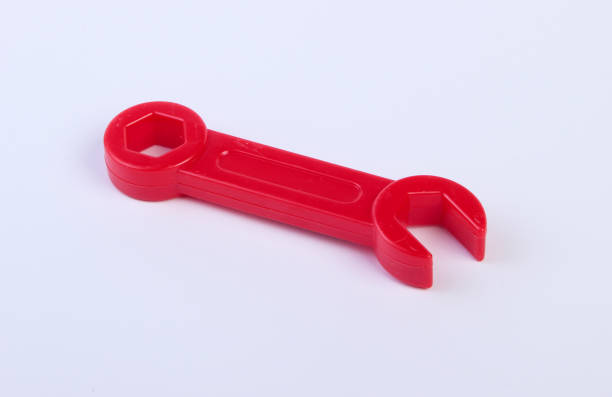istock Red toy plastic wrench on white background close up 1224309847