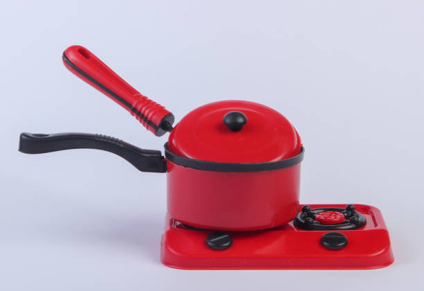 istock Toy plastic stove with pan on a white background. Kid's Kitchen 1224309856