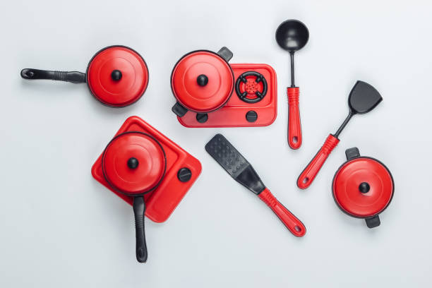 istock Toy set of children's kitchen on white background. Pots, kitchen tools, stove. Top view 1224310259