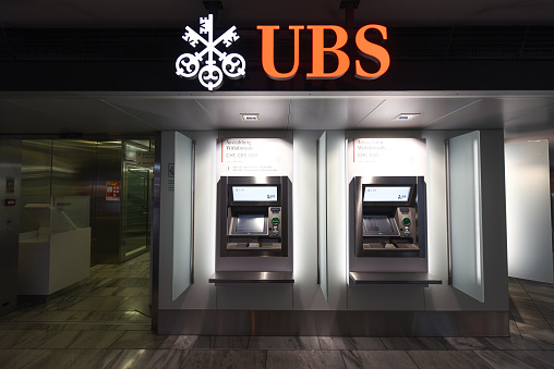 An ATM of the UBS bank. The image shows a close up of an ATM machine at the Zurich Airport ZRH during lockdown of the worldwide Coronavirus pandemic.