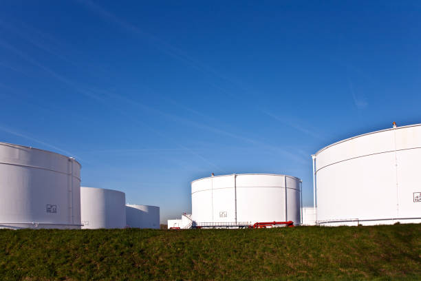 istock white tanks in tank farm with blue sky 1224312415