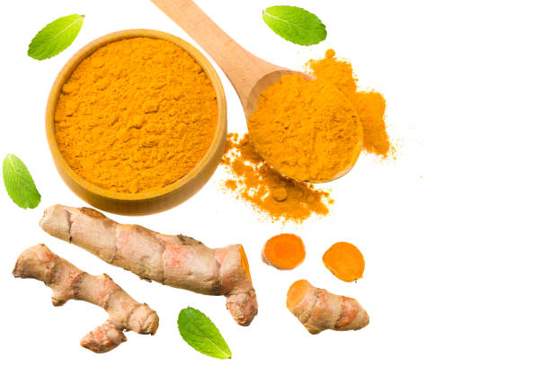istock Turmeric powder with turmeric root isolated on white background. Top view. 1224313237