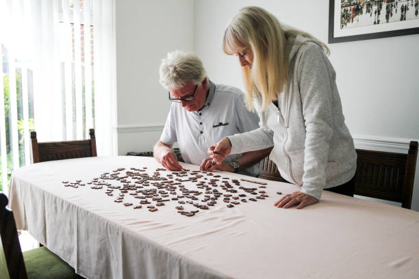 istock Senior couple doing jigsaw puzzle together at home 1224313301