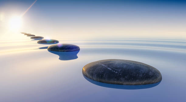 istock 3d render of black stones on calm sea water 1224313601