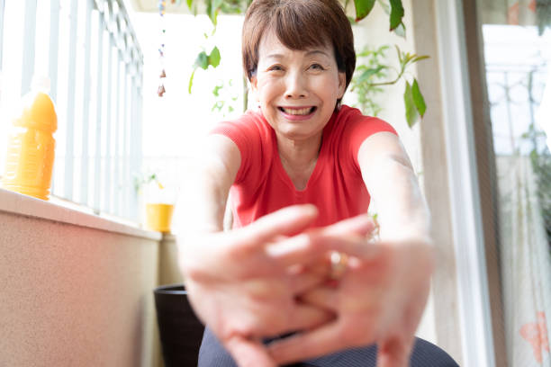 istock Senior woman training in balcony 1224313695