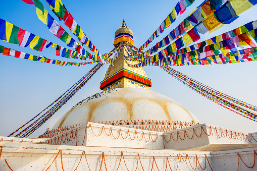 Sacred Boudhanath buddhist stupa with Prayer flags in Kathmandu. Famous Buddhist Stupa in the world
