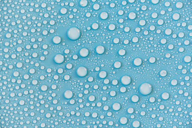 istock Close-up drops of water on blue surface, raindrops, background or texture 1224316181