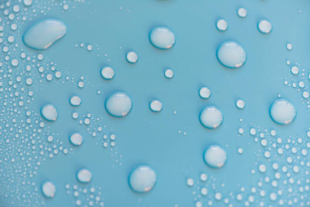 istock Close-up drops of water on blue surface, raindrops, background or texture 1224316186