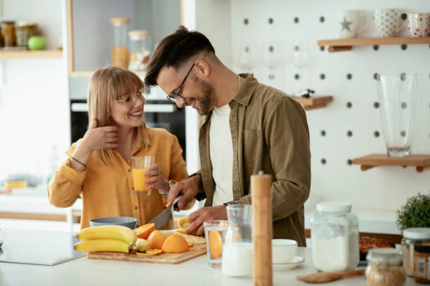 istock Young couple cooking together at home. 1224316397