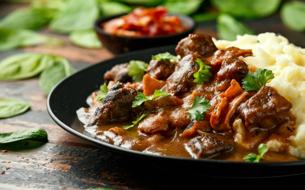istock Fried Liver, bacon in onion gravy with mashed potato 1224317482