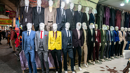 Isfahan, Iran - May 2019: Shop selling clothing for men in Grand Bazaar.
