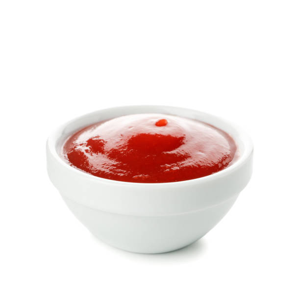 istock Bowl of tomato sauce isolated on white background 1224319268