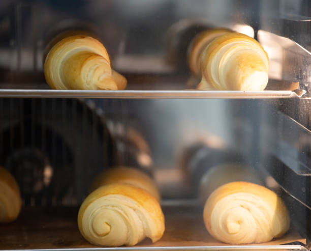 istock Baking tray with delicious croissants in oven 1224320695
