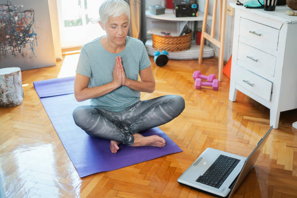 istock Mature woman exercise at home 1224320810