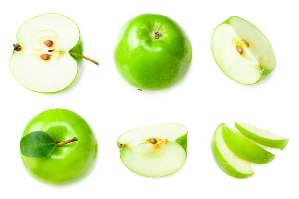 istock green apples with slices isolated on white background. top view 1224321143