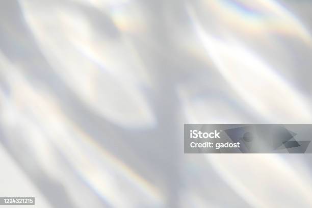 Organic Drop Shadow On A White Wall Stock Photo - Download Image Now - Glass - Material, Light - Natural Phenomenon, Reflection