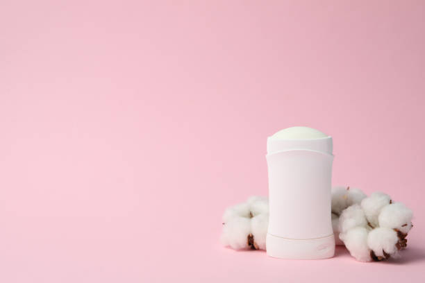 istock Body deodorant and cotton on pink background, blank space for text 1224323118