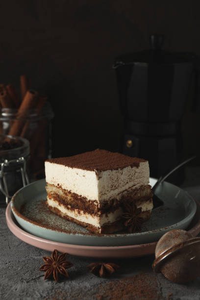 istock Composition with tiramisu, coffee maker and cinnamon on gray table 1224325249