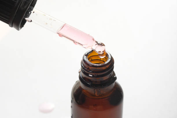 istock Pipette with drop, close up on white background 1224325343